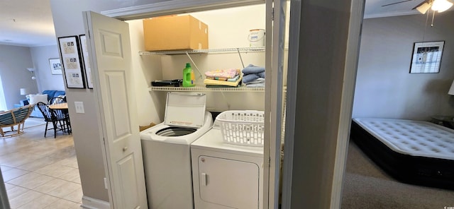 1100 Commons Blvd Unit 606, Myrtle Beach, SC 29572 - laundry room with washer and clothes dryer, crown molding, a ceiling fan, and light tile patterned floors