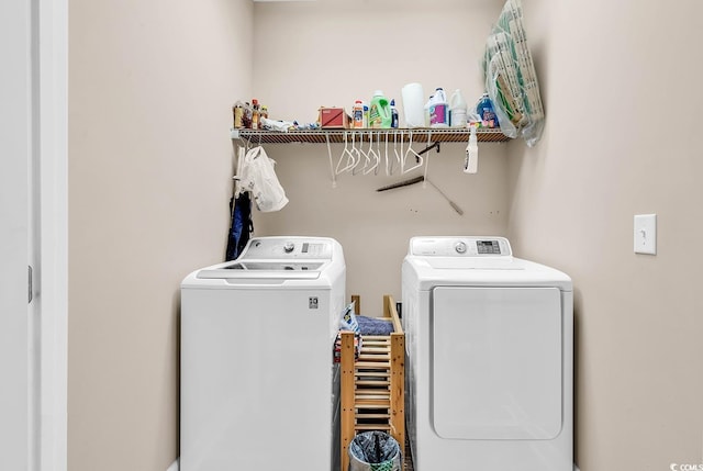 laundry room with washer and dryer and laundry area