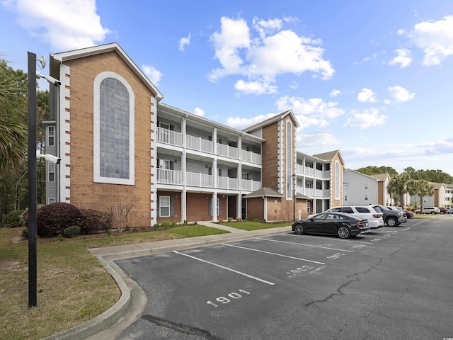 4854 Meadowsweet Dr Unit 1909, Myrtle Beach, SC 29579 - view of building exterior with uncovered parking