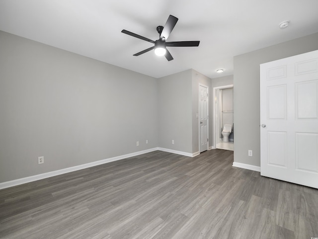 4854 Meadowsweet Dr Unit 1909, Myrtle Beach, SC 29579 - unfurnished bedroom with wood finished floors, ensuite bath, and ceiling fan