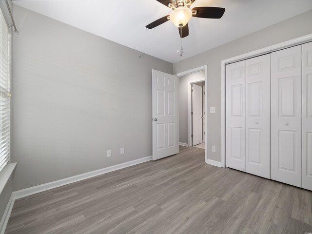 4854 Meadowsweet Dr Unit 1909, Myrtle Beach, SC 29579 - unfurnished bedroom featuring light wood-style floors, a closet, and a ceiling fan