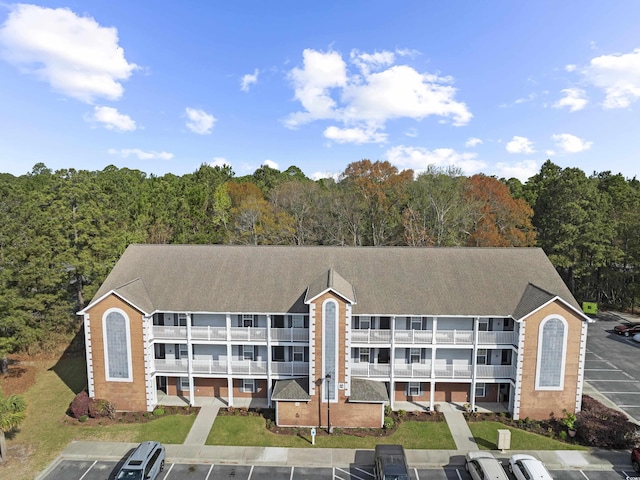 4854 Meadowsweet Dr Unit 1909, Myrtle Beach, SC 29579 - view of property with uncovered parking and a wooded view