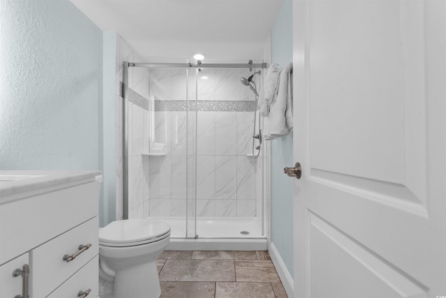 9550 Shore Dr Unit 1026, Myrtle Beach, SC 29572 - bathroom featuring vanity, toilet, a stall shower, and baseboards
