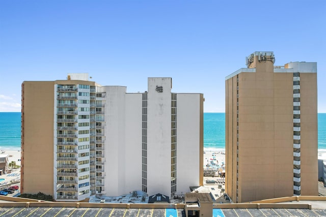 9550 Shore Dr Unit 1026, Myrtle Beach, SC 29572 - view of property with uncovered parking and view of water and beach