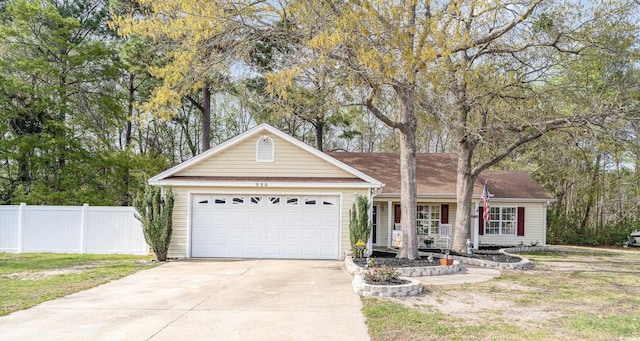 ranch-style home with fence, concrete driveway, and a garage
