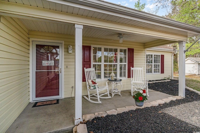 property entrance with a porch and ceiling fan