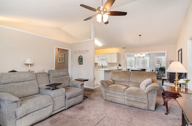 living area with vaulted ceiling, light carpet, and ceiling fan with notable chandelier