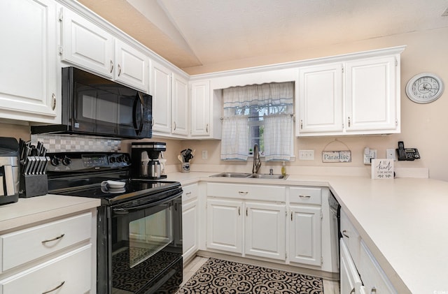 kitchen with light countertops, white cabinets, a sink, light tile patterned floors, and black appliances