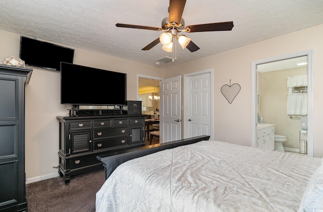 bedroom with carpet floors, baseboards, and a textured ceiling