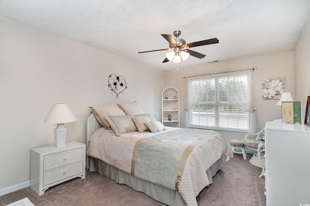 bedroom featuring a ceiling fan, baseboards, visible vents, and light carpet