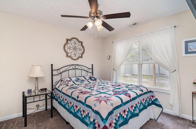 bedroom featuring carpet floors, baseboards, and visible vents