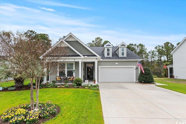 129 Astoria Park Loop, Conway, SC 29526 - craftsman-style house featuring a porch, a front lawn, driveway, and an attached garage