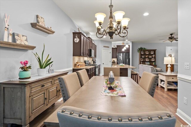 129 Astoria Park Loop, Conway, SC 29526 - dining area with wood finished floors, recessed lighting, baseboards, and ceiling fan with notable chandelier