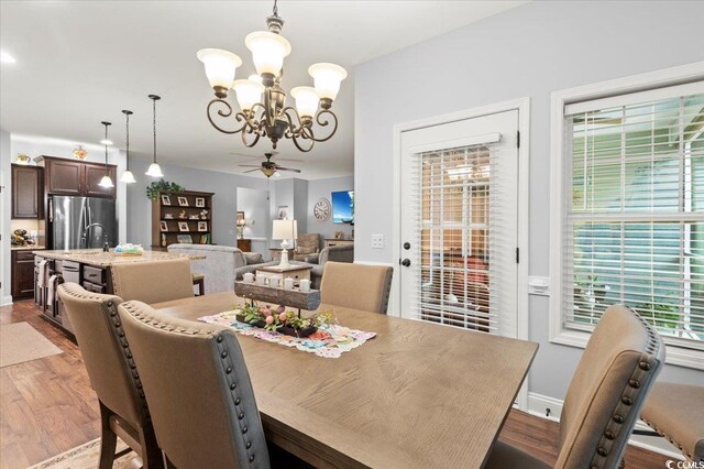 129 Astoria Park Loop, Conway, SC 29526 - dining space with recessed lighting, baseboards, wood finished floors, and ceiling fan with notable chandelier