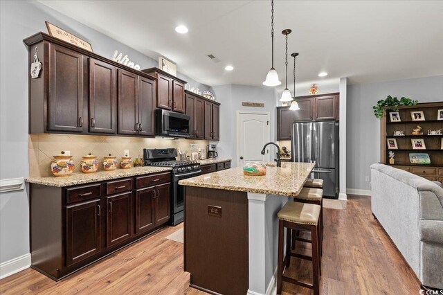 129 Astoria Park Loop, Conway, SC 29526 - dining area featuring visible vents, wood finished floors, a chandelier, and baseboards