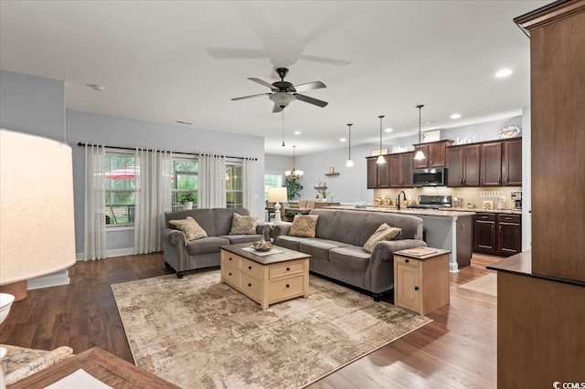 129 Astoria Park Loop, Conway, SC 29526 - living area featuring a ceiling fan and wood finished floors