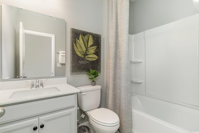 bathroom with vanity, toilet, and shower / tub combo