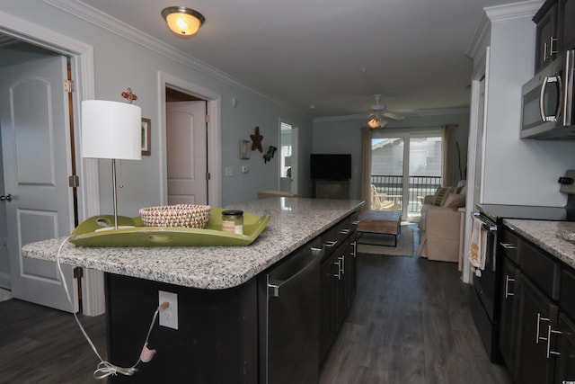 kitchen featuring a ceiling fan, electric range, crown molding, dark wood finished floors, and stainless steel microwave