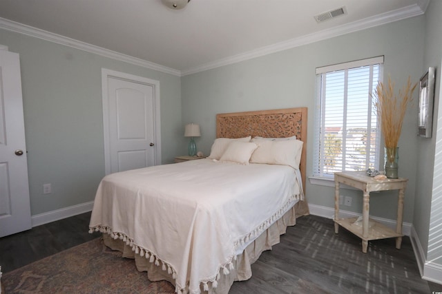 bedroom featuring baseboards, visible vents, ornamental molding, and dark wood-type flooring