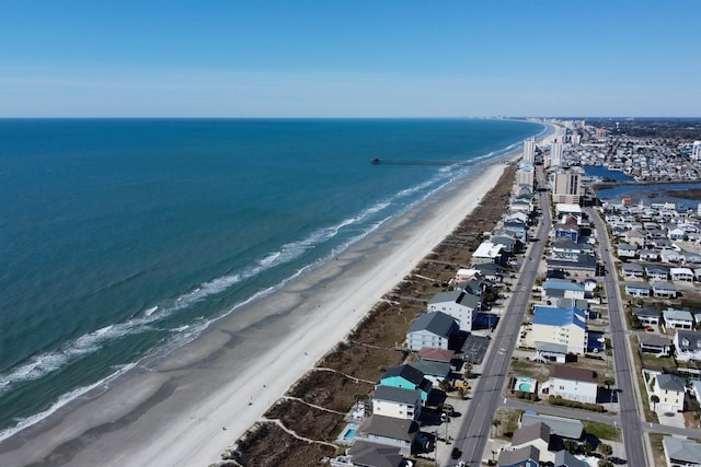 birds eye view of property featuring a water view and a view of the beach