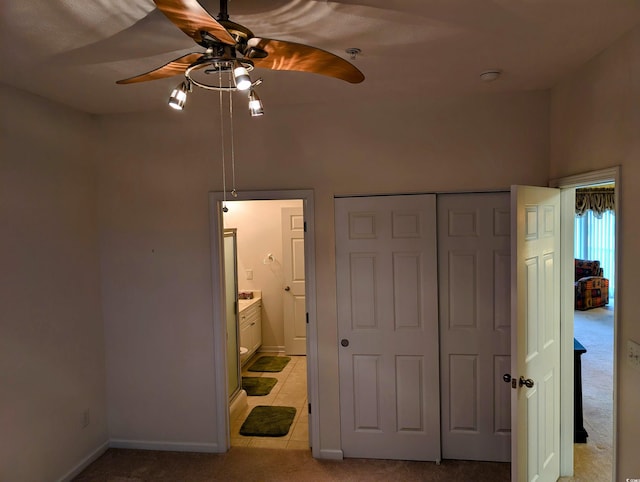 601 Hillside Dr N Unit 2245, North Myrtle Beach, SC 29582 - unfurnished bedroom featuring a closet, ensuite bathroom, light colored carpet, baseboards, and ceiling fan