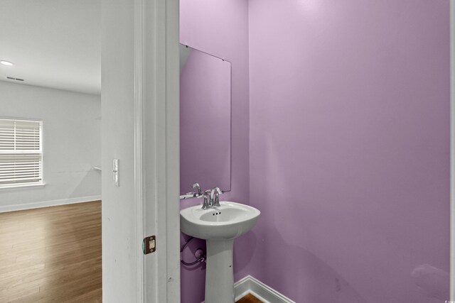 852 Harrison Mill St, Myrtle Beach, SC 29579 - bathroom with baseboards and wood finished floors
