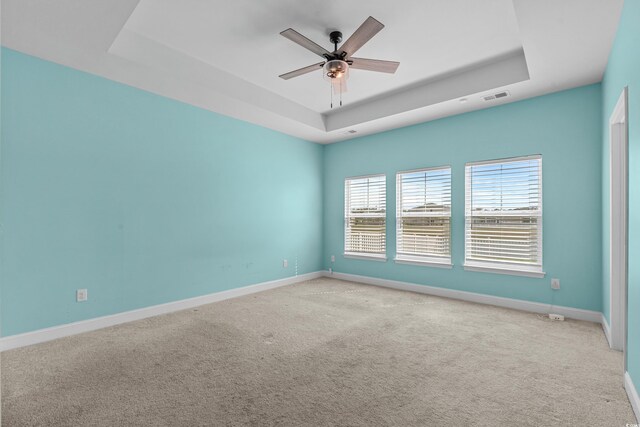 852 Harrison Mill St, Myrtle Beach, SC 29579 - empty room with a tray ceiling, carpet flooring, and a ceiling fan
