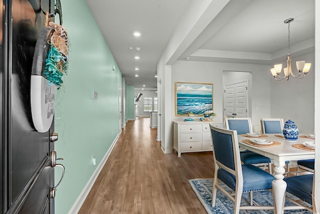 852 Harrison Mill St, Myrtle Beach, SC 29579 - dining area with light wood-type flooring, a chandelier, recessed lighting, and a tray ceiling