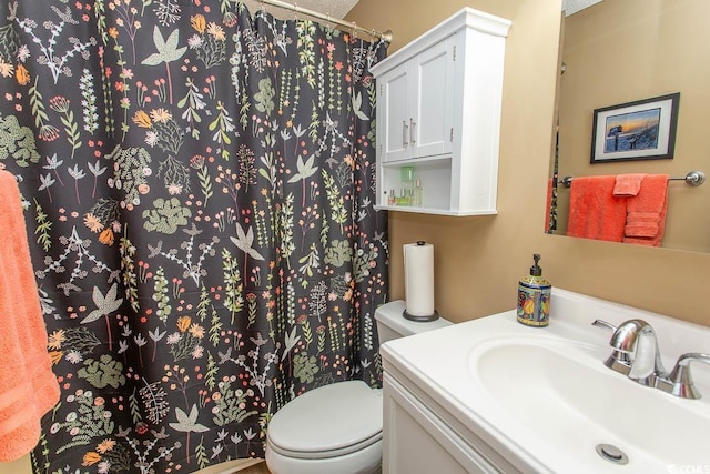 1221 Tidewater Dr Unit 1922, North Myrtle Beach, SC 29582 - bathroom with toilet, vanity, and a shower with shower curtain