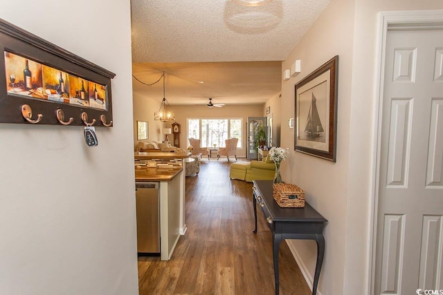 1221 Tidewater Dr Unit 1922, North Myrtle Beach, SC 29582 - hall with wood finished floors, a textured ceiling, and baseboards
