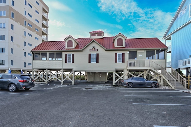 1221 Tidewater Dr Unit 1922, North Myrtle Beach, SC 29582 - view of property with uncovered parking and stairs