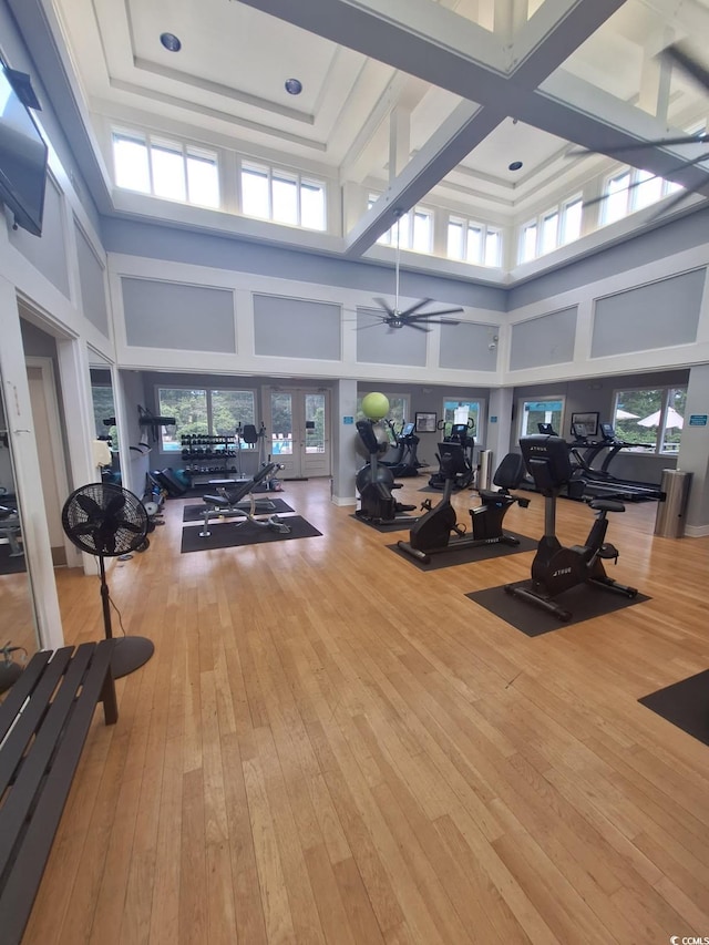 1221 Tidewater Dr Unit 1922, North Myrtle Beach, SC 29582 - workout area featuring a high ceiling, hardwood / wood-style floors, ceiling fan, and french doors