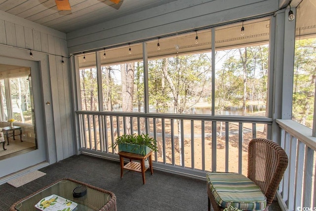 1221 Tidewater Dr Unit 1922, North Myrtle Beach, SC 29582 - sunroom with a ceiling fan, a water view, and view of wooded area