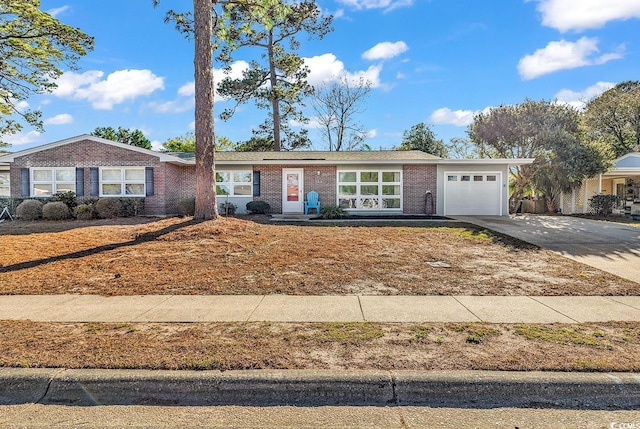 3783 Vine St Unit 3783, Myrtle Beach, SC 29577 - ranch-style home featuring driveway, an attached garage, and brick siding
