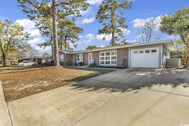 3783 Vine St Unit 3783, Myrtle Beach, SC 29577 - view of front facade featuring driveway, brick siding, and a garage