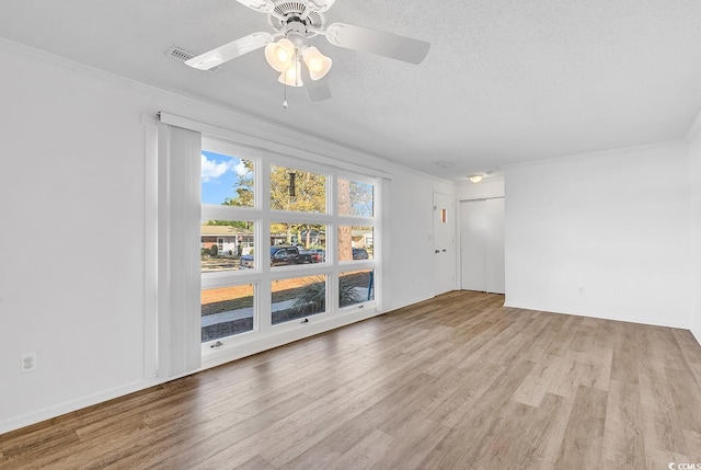 3783 Vine St Unit 3783, Myrtle Beach, SC 29577 - spare room with a textured ceiling, crown molding, baseboards, ceiling fan, and wood finished floors