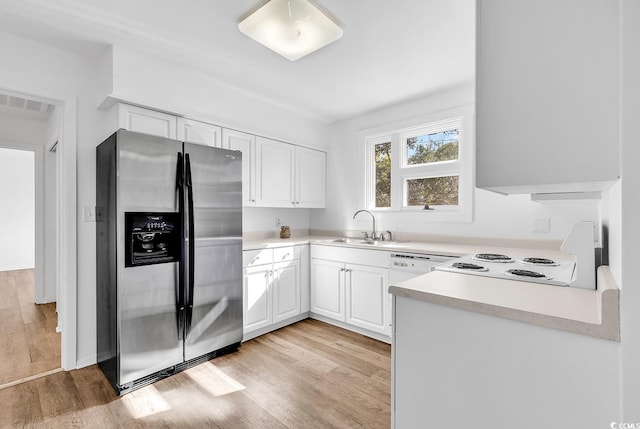 3783 Vine St Unit 3783, Myrtle Beach, SC 29577 - kitchen with light wood-style flooring, a sink, stainless steel refrigerator with ice dispenser, and white cabinets