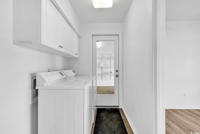 3783 Vine St Unit 3783, Myrtle Beach, SC 29577 - clothes washing area with cabinet space, baseboards, separate washer and dryer, and wood finished floors