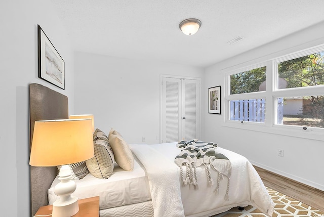 3783 Vine St Unit 3783, Myrtle Beach, SC 29577 - bedroom featuring baseboards, a closet, and wood finished floors