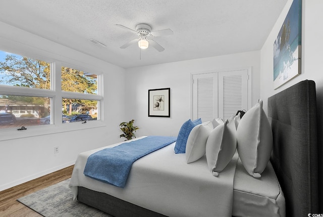 3783 Vine St Unit 3783, Myrtle Beach, SC 29577 - bedroom with a ceiling fan, wood finished floors, a textured ceiling, baseboards, and visible vents