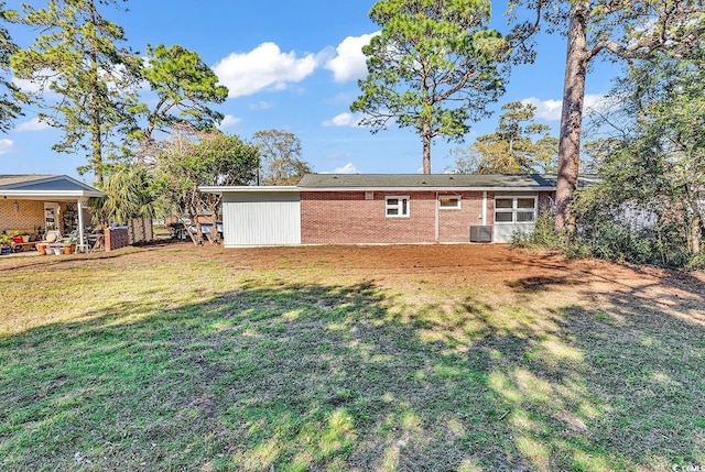 3783 Vine St Unit 3783, Myrtle Beach, SC 29577 - rear view of property with central AC and a lawn