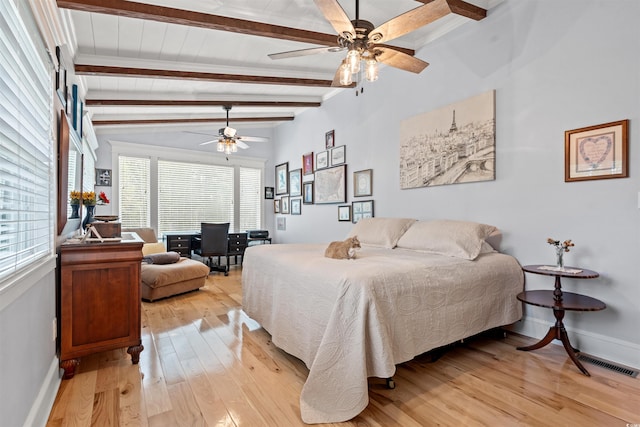 bedroom with baseboards, visible vents, multiple windows, and light wood-style floors