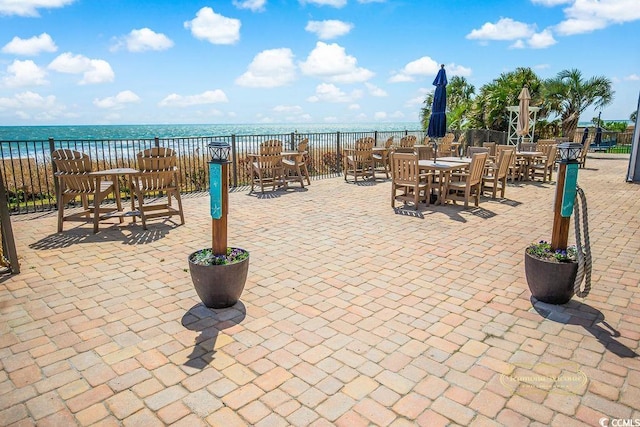 2001 S Ocean Blvd S Unit 310, Myrtle Beach, SC 29577 - view of patio / terrace with a water view and outdoor dining area