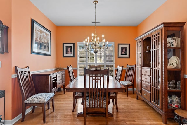 808 Arbor Ln, North Myrtle Beach, SC 29582 - dining area with a chandelier and light wood-type flooring