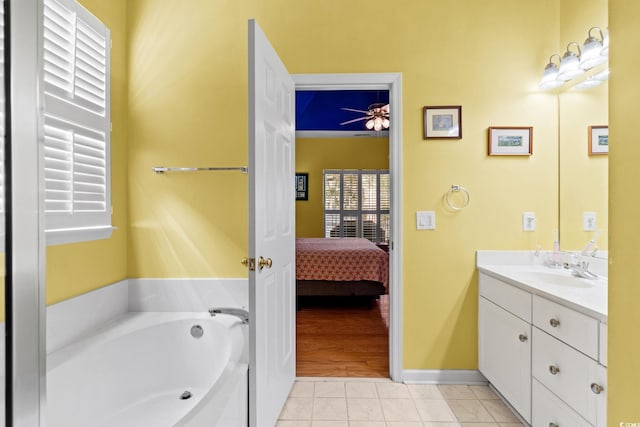 808 Arbor Ln, North Myrtle Beach, SC 29582 - bathroom featuring vanity, a bath, ensuite bath, a ceiling fan, and tile patterned floors