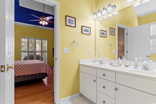 808 Arbor Ln, North Myrtle Beach, SC 29582 - bathroom with ensuite bath, double vanity, a ceiling fan, and wood finished floors