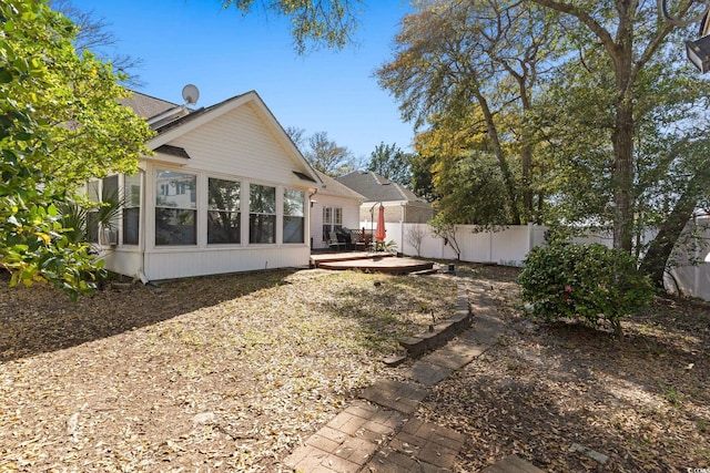 808 Arbor Ln, North Myrtle Beach, SC 29582 - back of property with a wooden deck and a sunroom