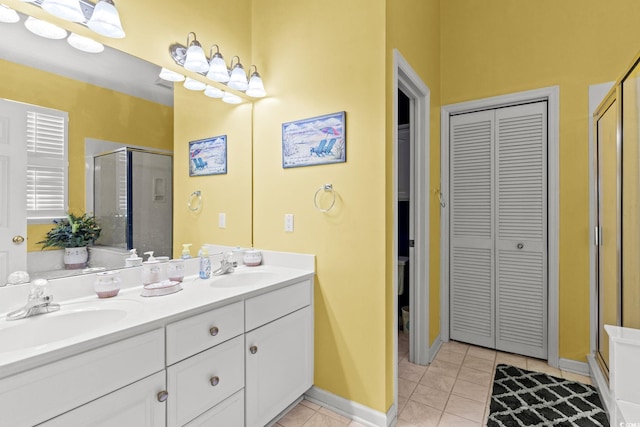 808 Arbor Ln, North Myrtle Beach, SC 29582 - bathroom featuring a closet, a shower stall, double vanity, and tile patterned floors