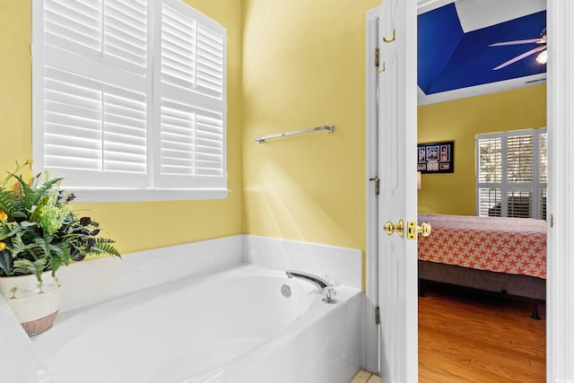 808 Arbor Ln, North Myrtle Beach, SC 29582 - ensuite bathroom with a bath and wood finished floors