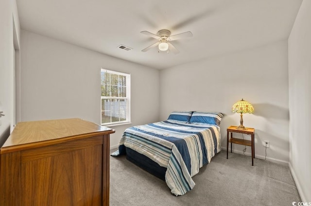 bedroom with light carpet, baseboards, ceiling fan, and visible vents